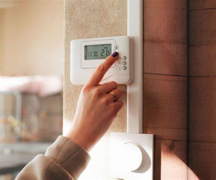 Where should a wall thermostat be installed?